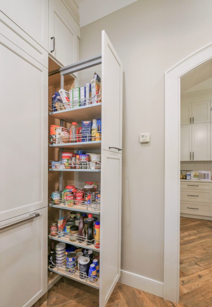 a view of the pullout pantry in action showing storage capacity