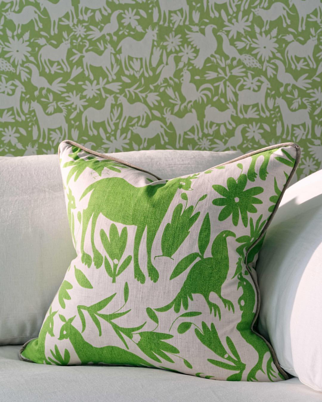 Green and white patterned pillow on white sofa, green and white interior decor ideas, green and white interior design, interior designer cornwall, interior designer ottawa, sheridan interiors