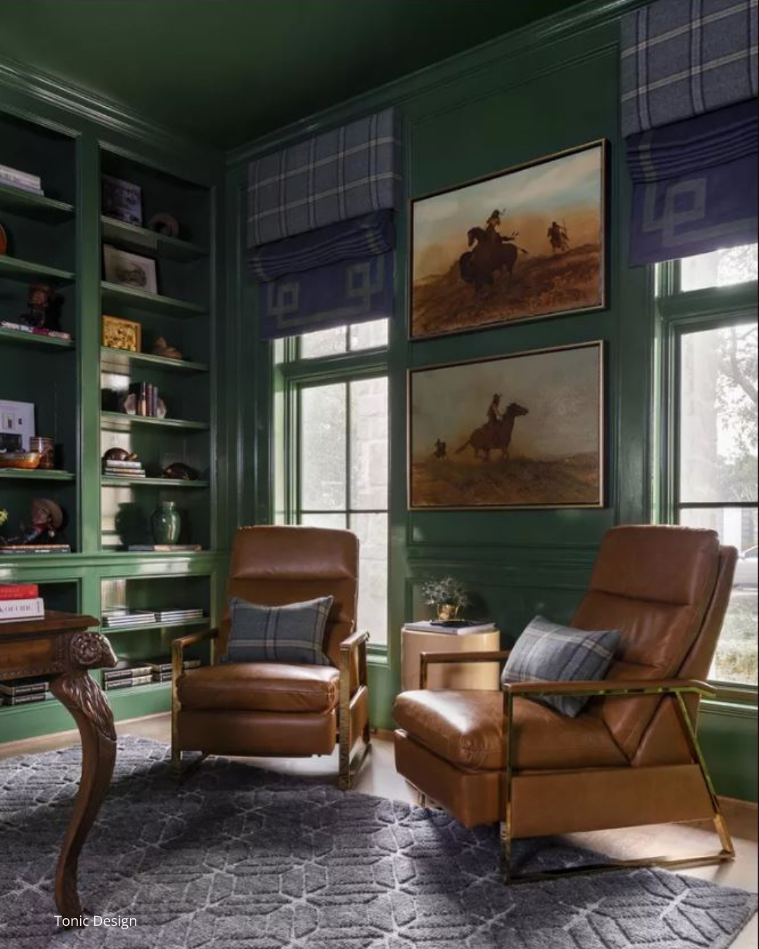 Traditional library in dark green colour, tan leather chairs, plaid custom window valances over custom roman shades.  Sheridan Interiors,  luxury interior designer providing custom window treatments for Ottawa, Cornwall and and surrounding areas.